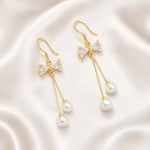 Load image into Gallery viewer, Crystal Bow Pearl Drop Earrings