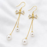 Load image into Gallery viewer, Crystal Bow Pearl Drop Earrings