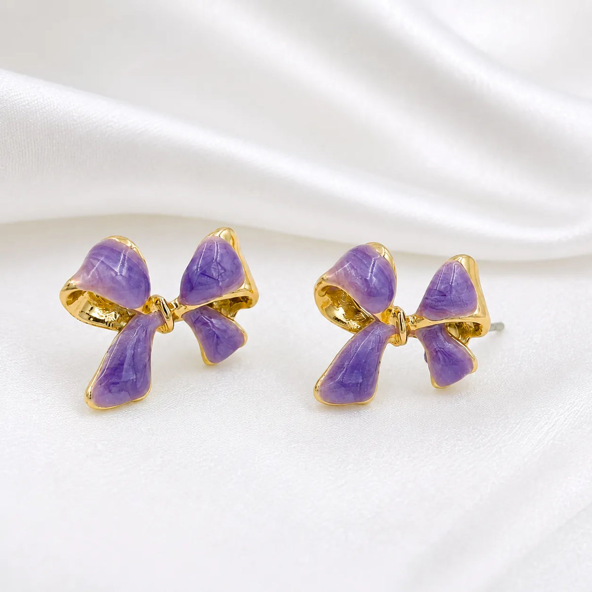 Lavender bow gold rim stud earrings
