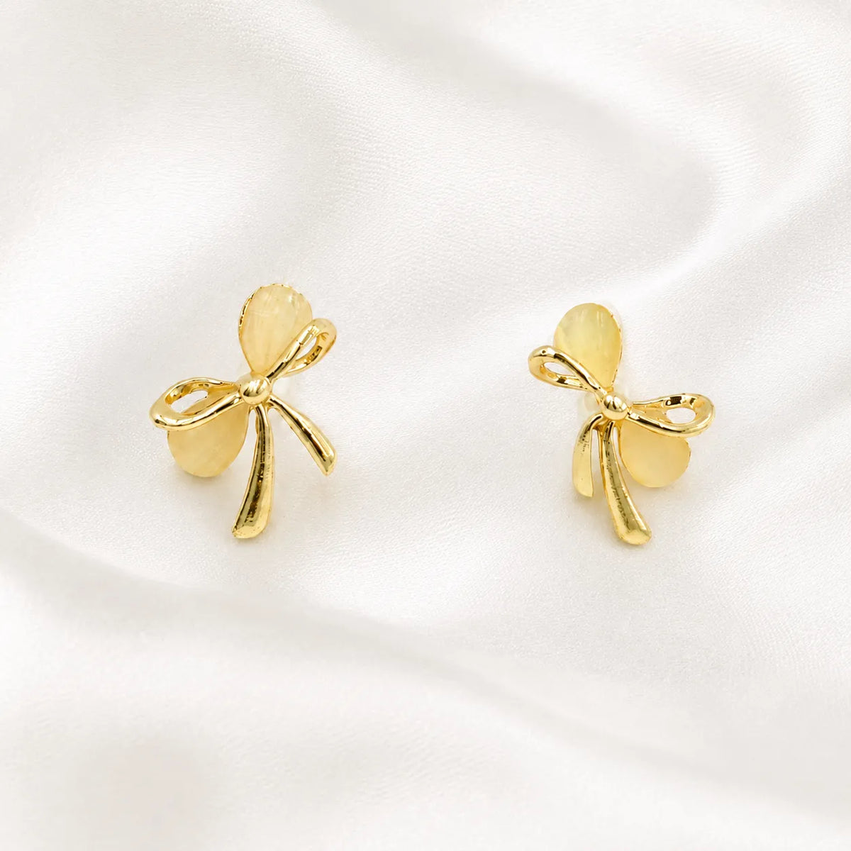 Gold open bow opal stud earrings