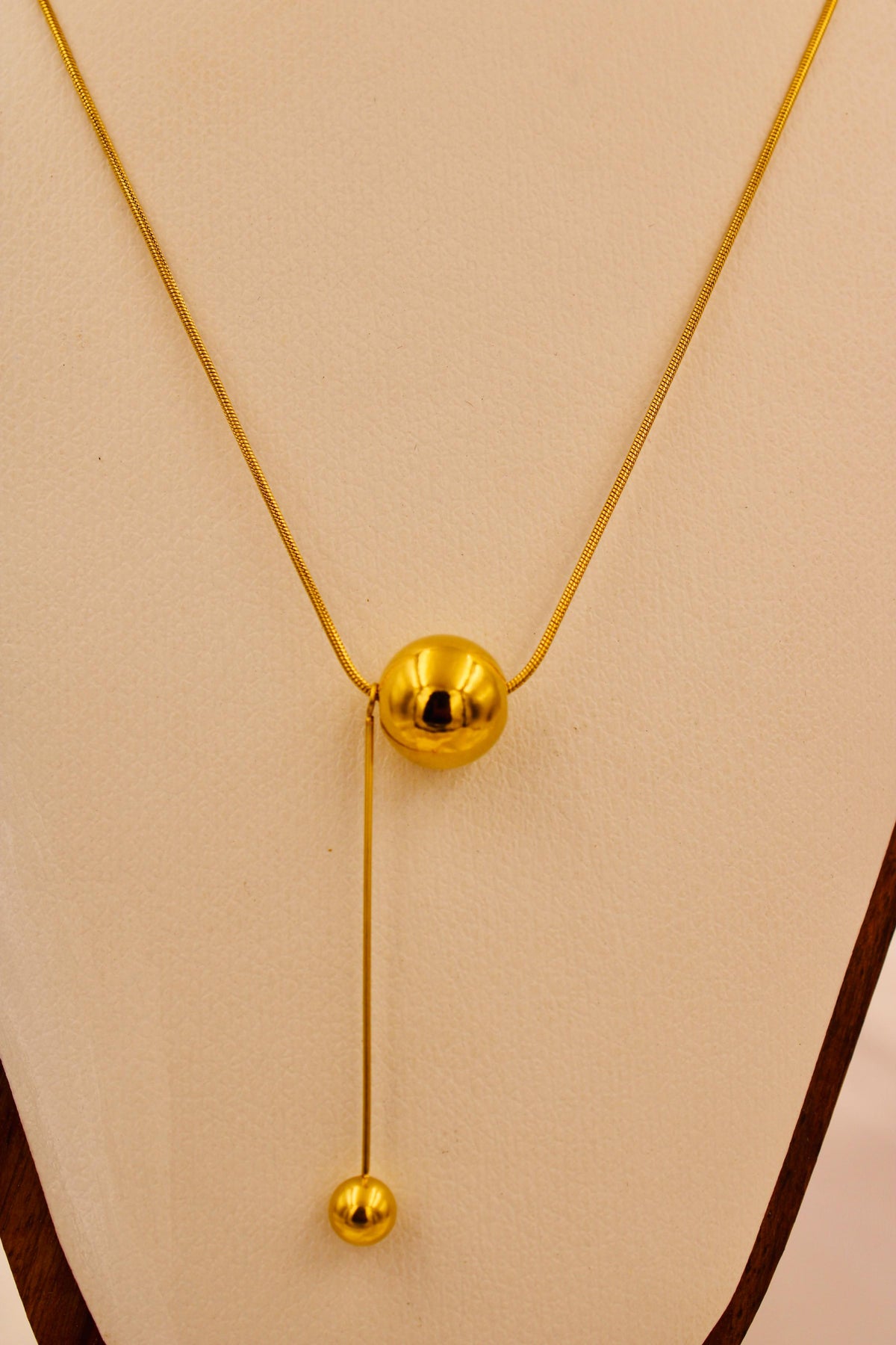 Gold sphere lariat necklace